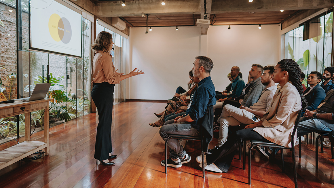 Woman presenting at a conference